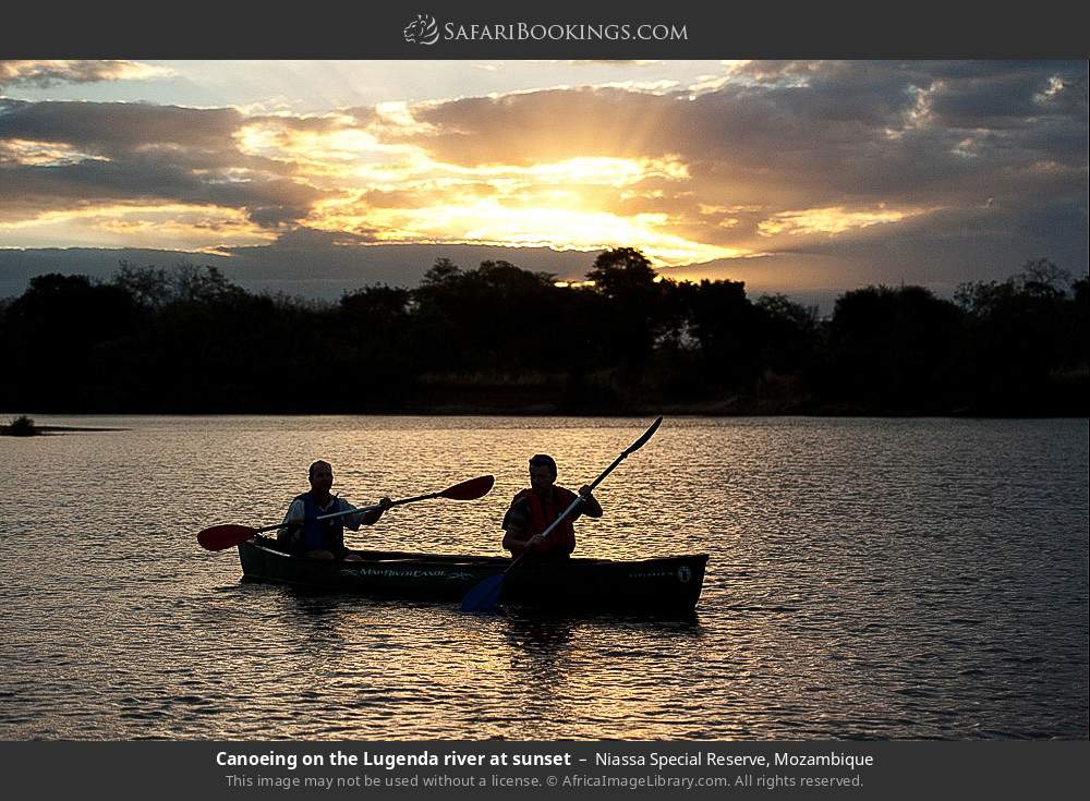 Canoeing on the Lugenda River at sunset in Niassa Special Reserve, Mozambique