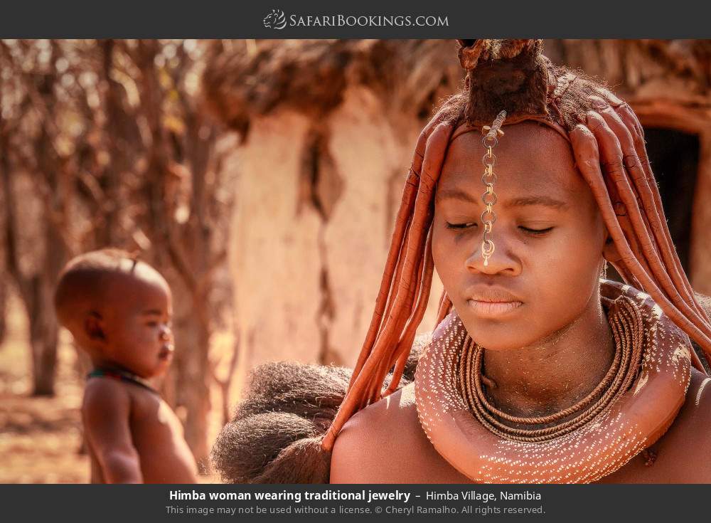 Himba woman wearing traditional jewelry in Himba Village, Namibia
