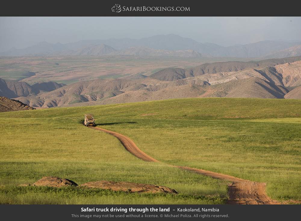 Safari truck driving through the land in Kaokoland, Namibia