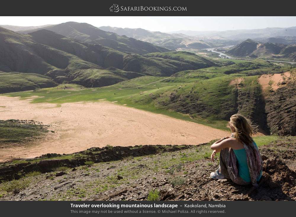 Traveler overlooking mountainous landscape in Kaokoland, Namibia