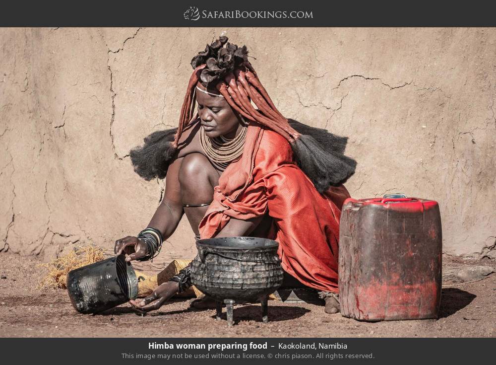 Himba woman preparing food in Kaokoland, Namibia