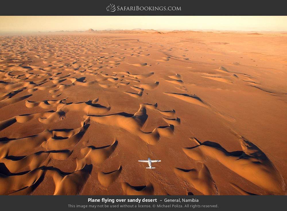 Plane flying over sandy desert in General, Namibia