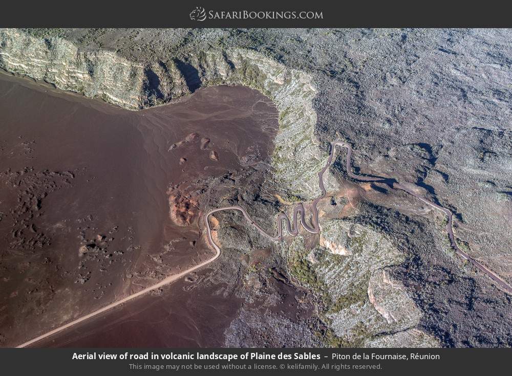 Aerial view of road in volcanic landscape of Plaine des Sables in Piton de la Fournaise, Réunion