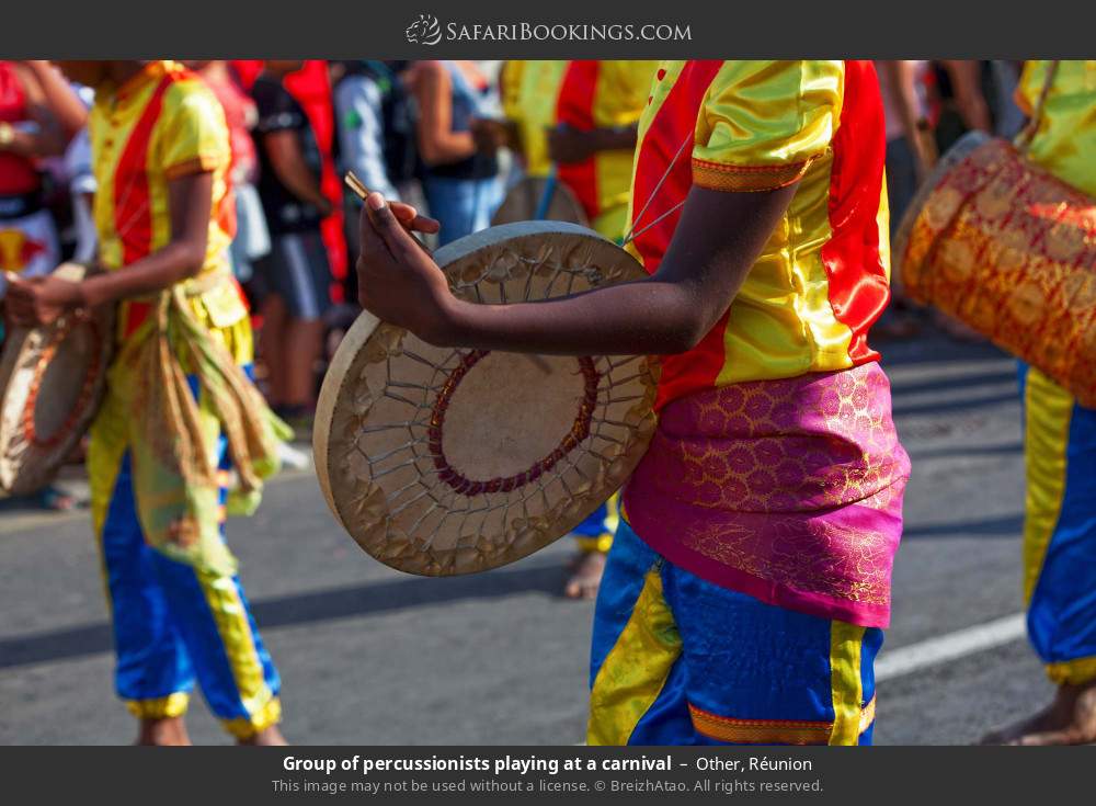 Group of percussionists playing at a carnival in Other, Réunion