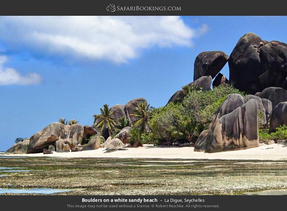 Boulders on a white sandy beach in La Digue, Seychelles