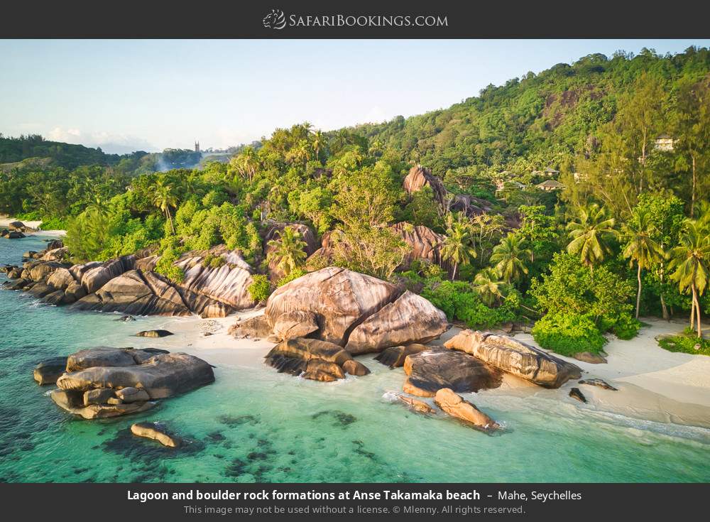 Lagoon and boulder rock formations at Anse Takamaka beach in Mahe, Seychelles