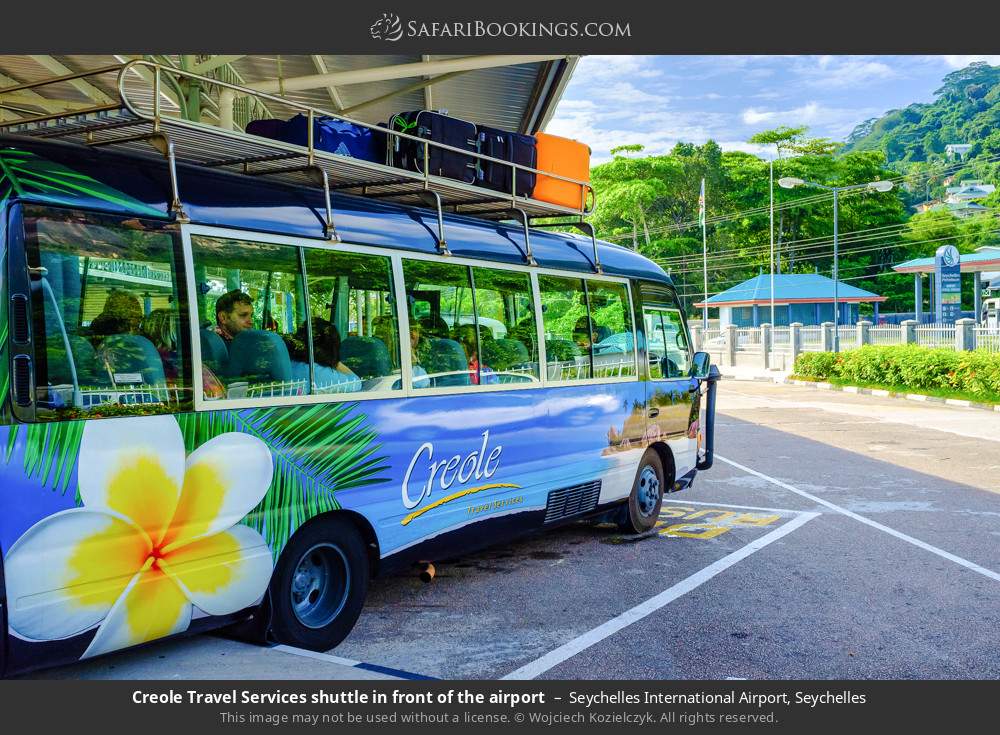 Creole Travel Services shuttle in front of the airport in Seychelles International Airport, Seychelles