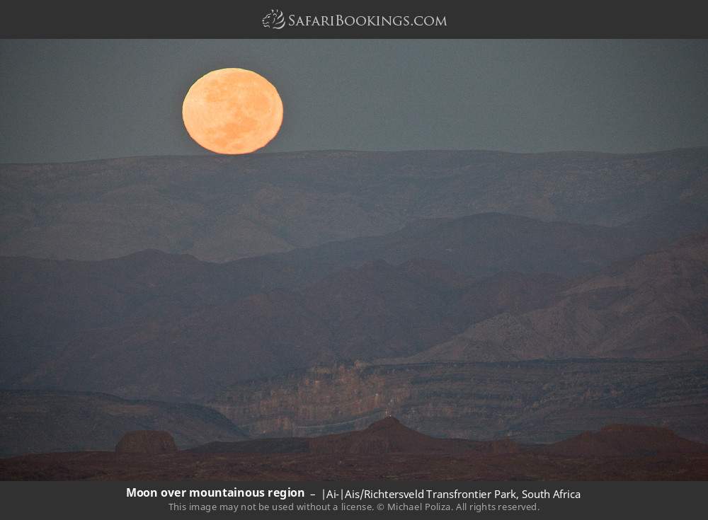 Moon over mountainous region in |Ai-|Ais/Richtersveld Transfrontier Park, South Africa