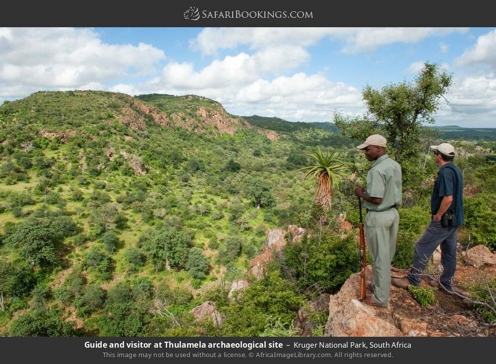 Guide and visitor at Thulamela archaeological site in Kruger National Park, South Africa