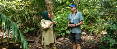 Guide and visitor on a forest hike
