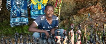 Vendor selling crafts on the beach