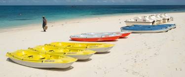 Sea kayaks lying on the beach