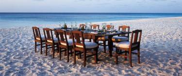 Dining on the beach at Mnemba Island Lodge on Mnemba Island