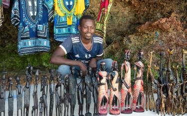 Thumbnail of Vendor selling crafts on the beach