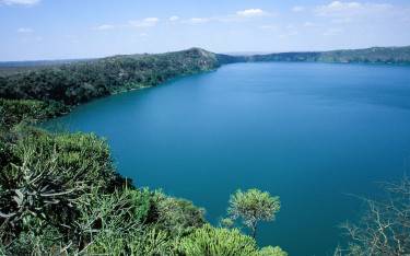 Blue crater lake fed by drainage from Mt Kilimanjaro