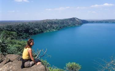 Blue crater lake fed by drainage from Mt Kilimanjaro