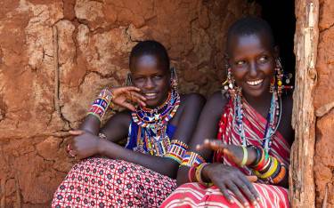 Maasai women in a mud hut