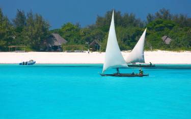 Ngawalas sailing past Mnemba Island