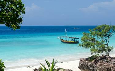 Thumbnail of Wooden boat on turquoise water