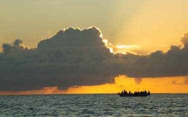 Fishing boat at sunrise