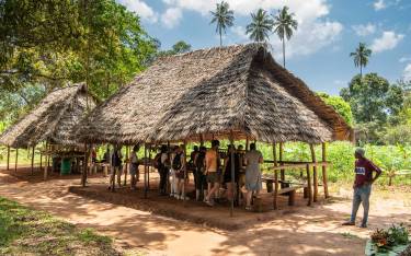 Visitors buying spices on a spice farm tour