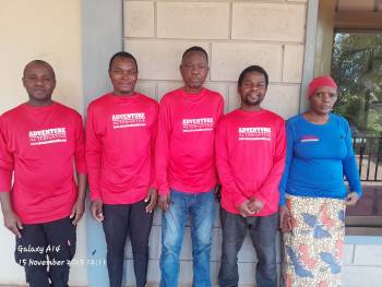 Staff and vehicle at our campsite office in Moshi.