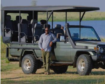 John while on a game drive/ safari 