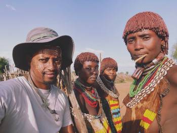 Mulugeta with Hamer tribe girls, a rare moment