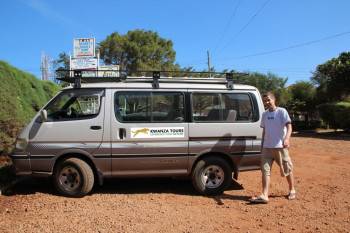 Director of Kwanza Tours with Safari Van 4WD