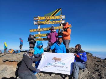 Our Director with the Team at the Roof of Africa