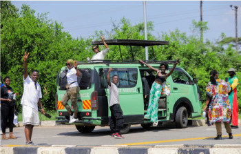 Guests posing around our safari tour van.